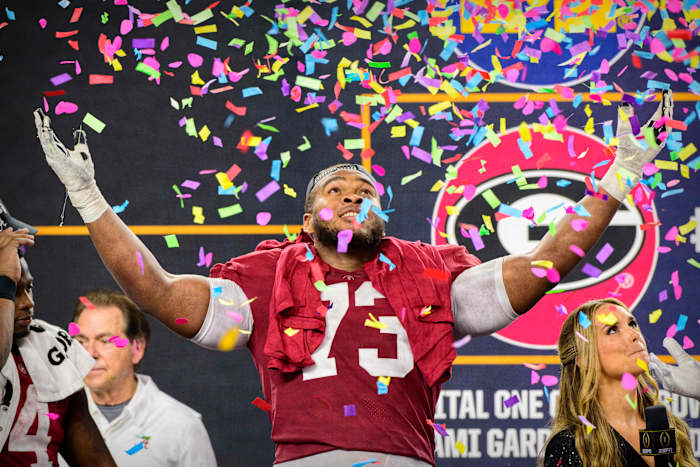 Alabama Crimson Tide offensive lineman Evan Neal (73) celebrates the win over the Cincinnati Bearcats after the 2021 Cotton Bowl college football CFP national semifinal game at AT&T Stadium.
